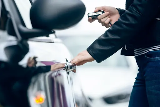 Professional locksmith programming car key for vehicle security